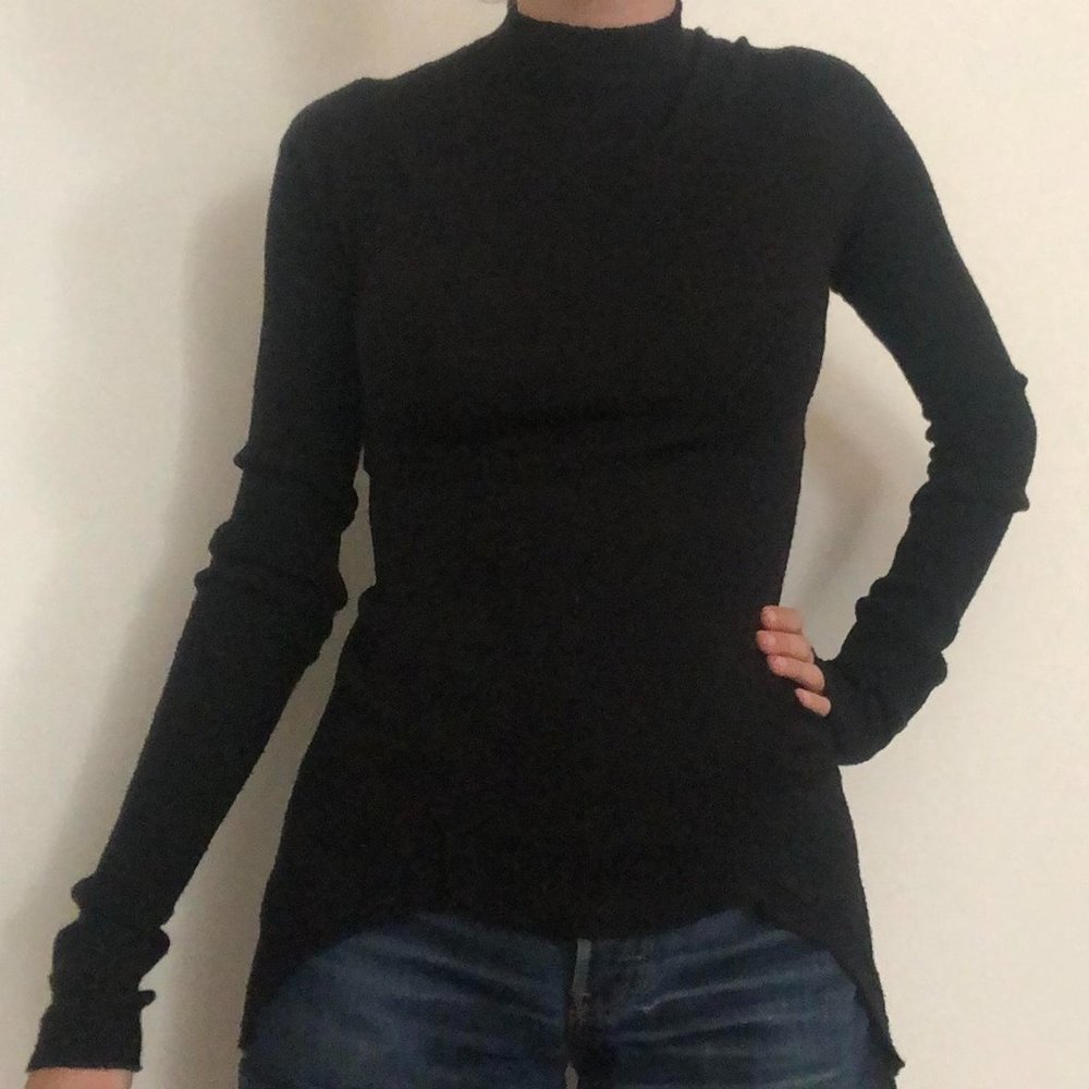 Rick Owen’s black mock neck sweater